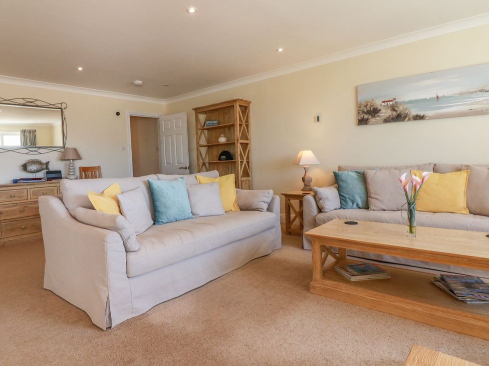 A living room with a sofa and coffee table at 2 Burgh Island Causeway in Kingsbridge