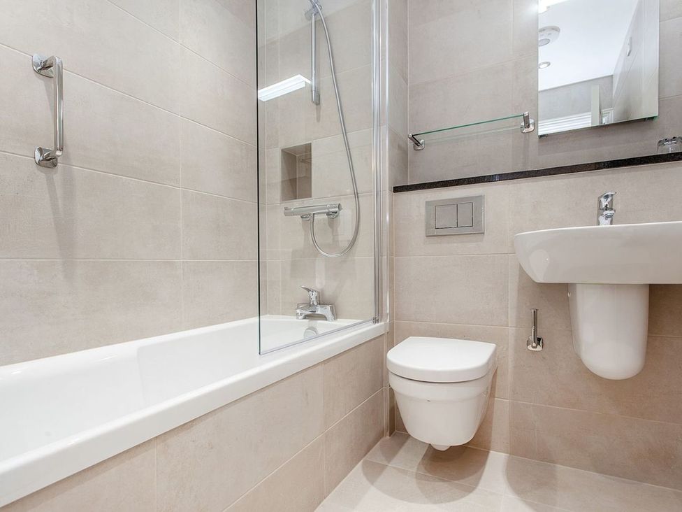 A bathroom with a bathtub and shower at 2 Burgh Island Causeway in Kingsbridge