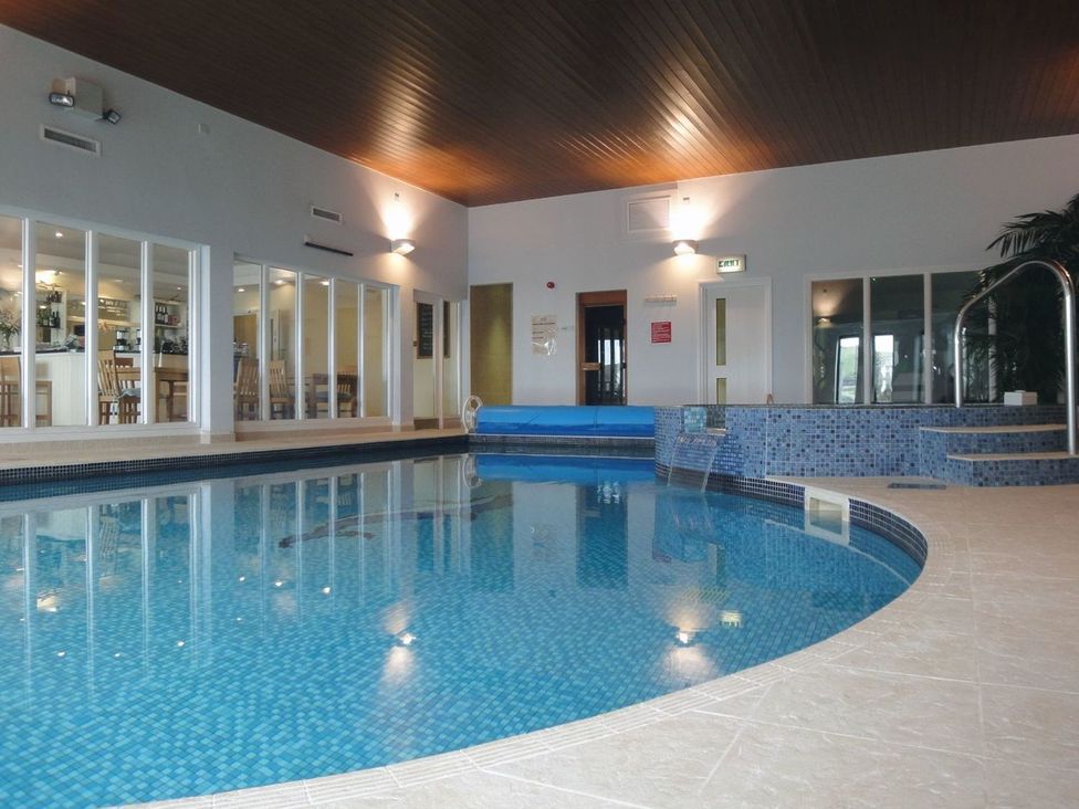 An indoor pool with a bar area at 2 Burgh Island Causeway in Kingsbridge