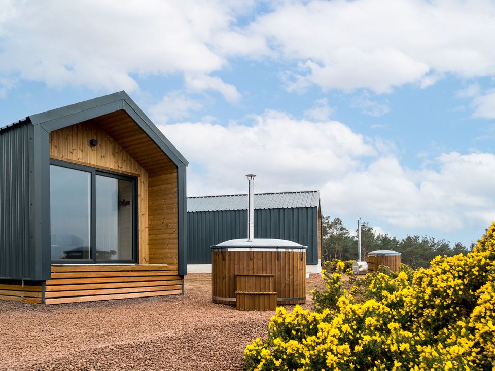An outdoor area with buildings and hot tubs at The Grays in North Berwick
