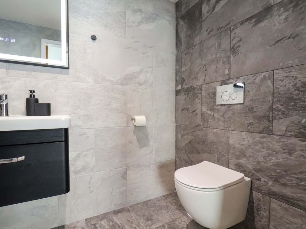 A bathroom with a toilet and sink at The Homestead in Moorsholm