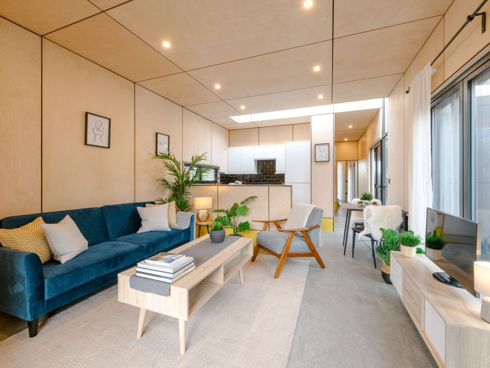 A living room with a couch and coffee table at Orka 1.0 (Pet) Dumfries