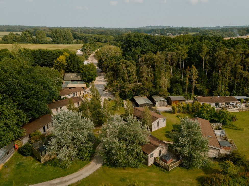An aerial view of houses and trees at Hurricane Lodge in Fair Oak