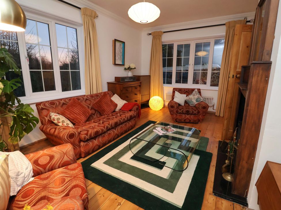 A living room with a sofa and coffee table at The White House in Norwich