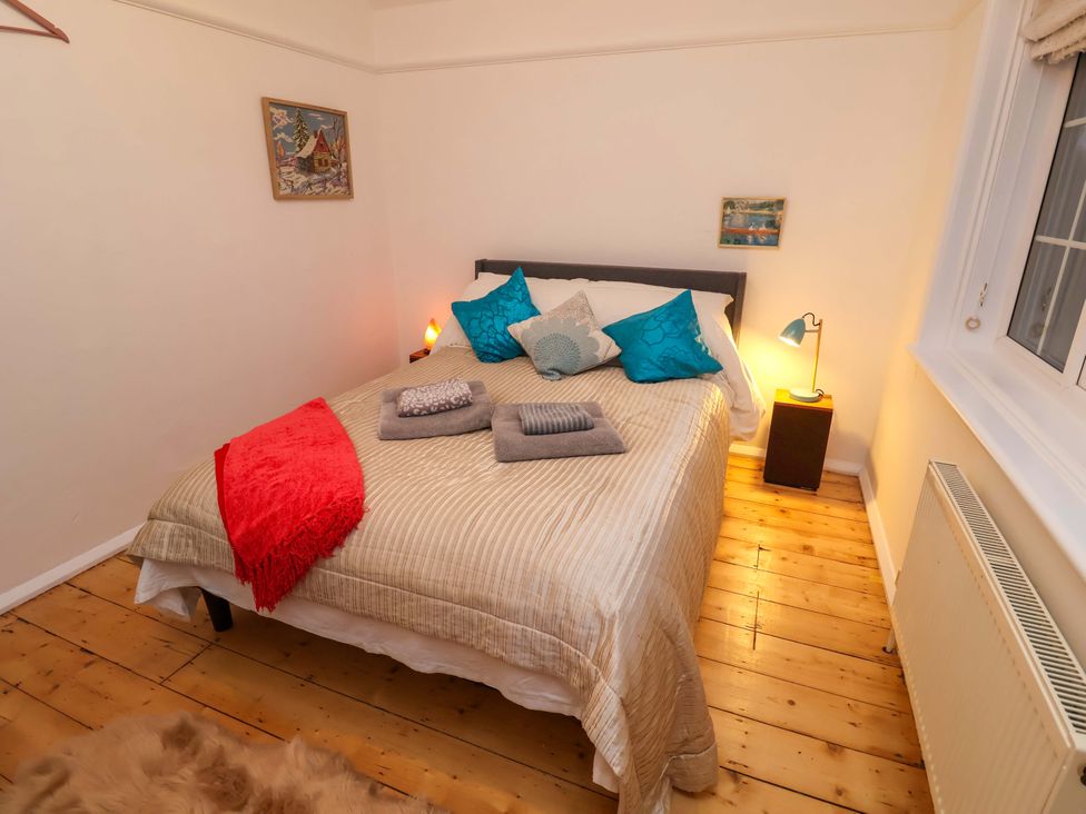A bedroom with a bed and pillows at The White House in Norwich