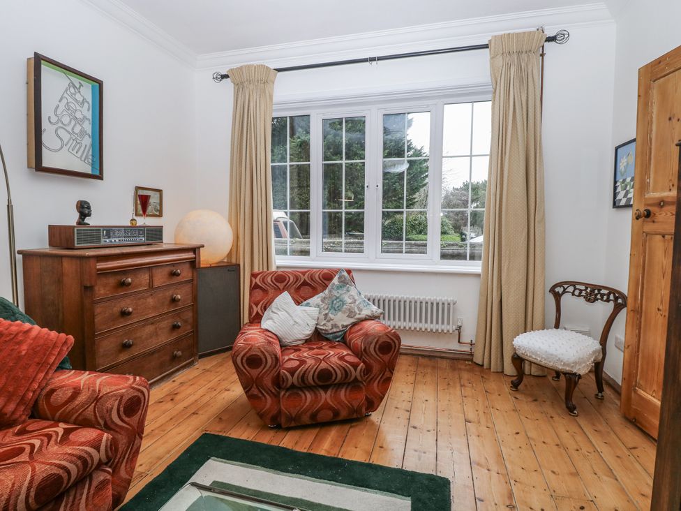 A living room with a sofa and a window at The White House in Bracondale
