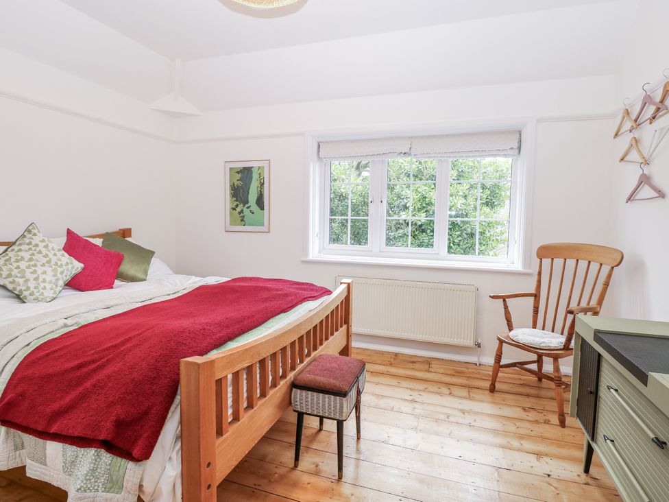 A bedroom with a bed and window at The White House in Bracondale