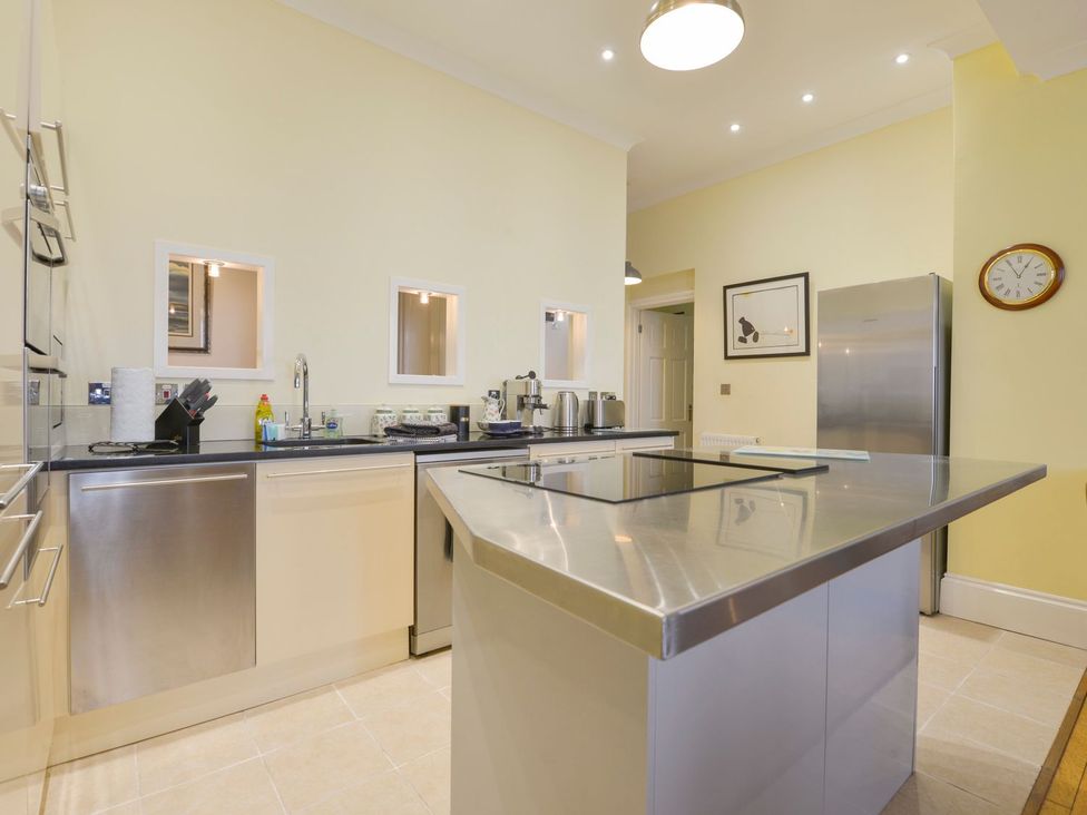 A kitchen with stainless steel appliances and a counter at The Old Signal House in Torpoint