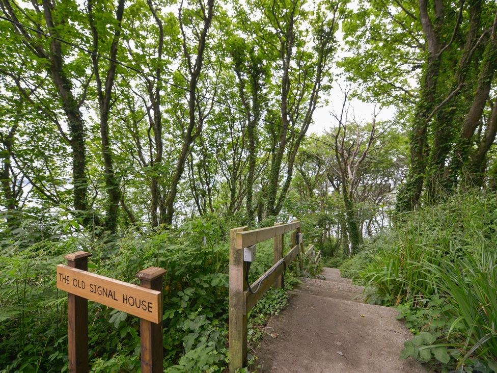 A pathway leading down with stairs and a sign at The Old Signal House in Torpoint