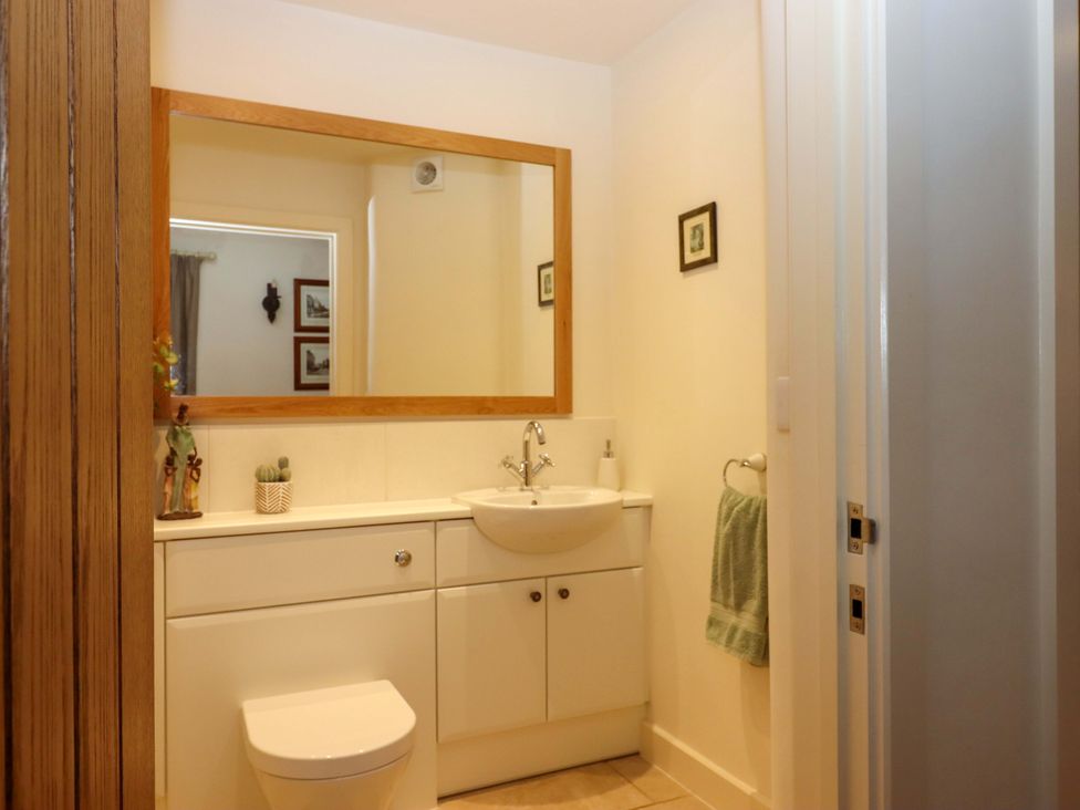 A bathroom with a sink and toilet at Grange Cottage in Coldridge