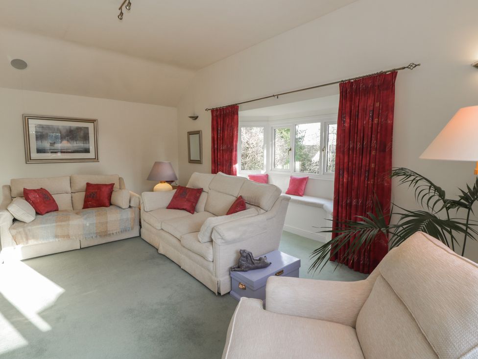 A living room with sofas and a window at Summerhill in Hereford