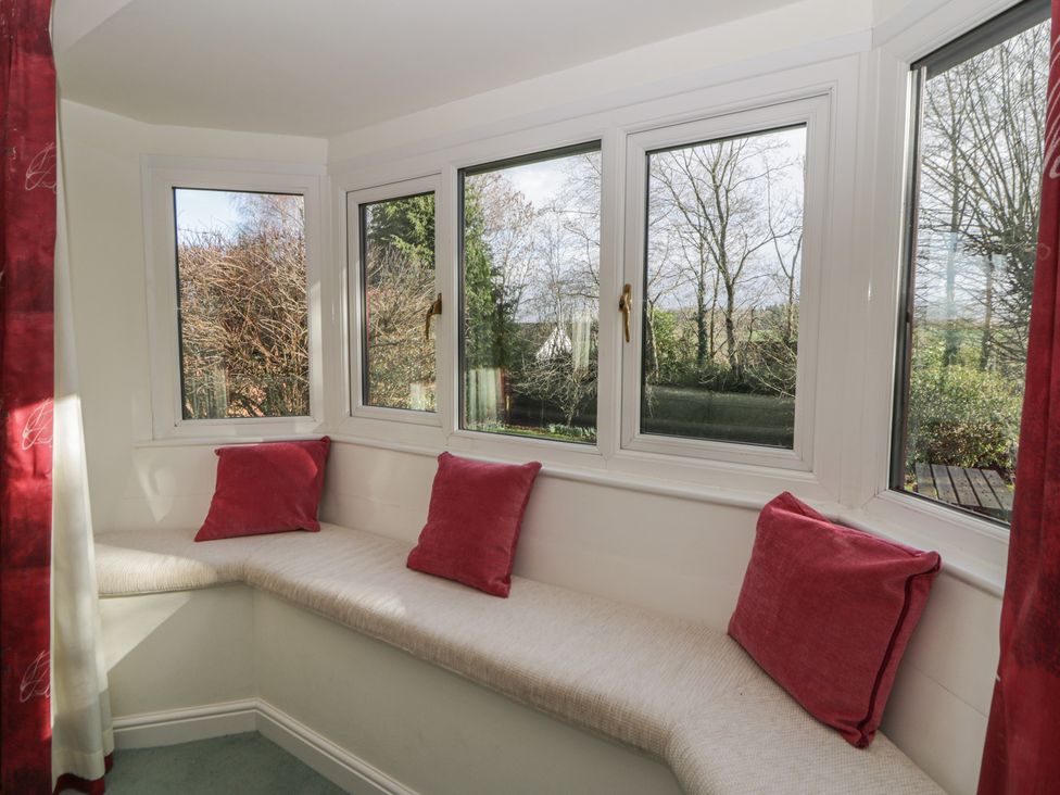 A snug with windows and a bench at Summerhill Hereford