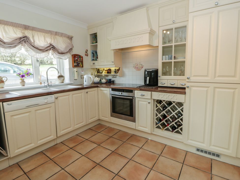 A kitchen with a sink and oven at Summerhill in Hereford