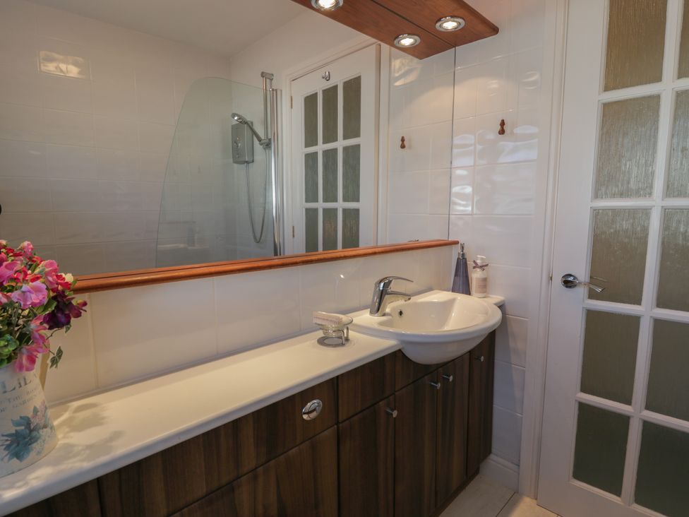 A bathroom with a sink and mirror at Summerhill in Hereford