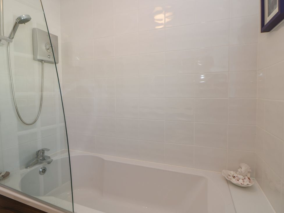 A bathroom with a bathtub and shower at Summerhill in Hereford