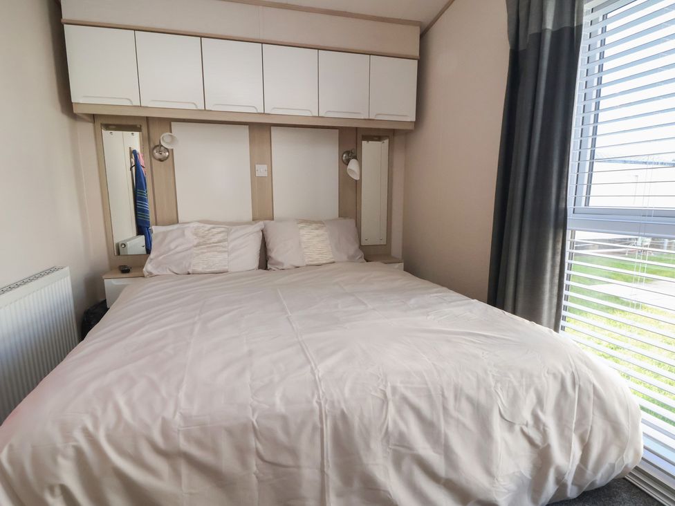 A bedroom with a bed and a window at CG 55