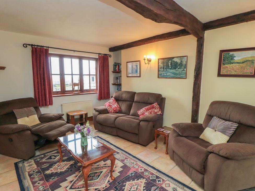 A living room with sofas and a coffee table at The Stables in Fifehead Neville near Hazelbury Bryan