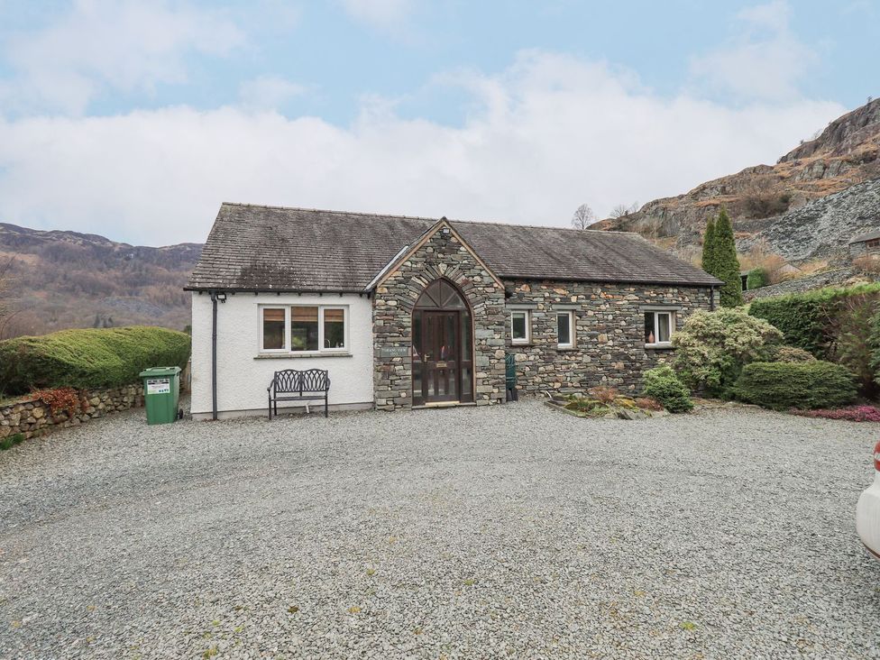 A house with gravel driveway and landscaping at Thrang View in Chapel Stile
