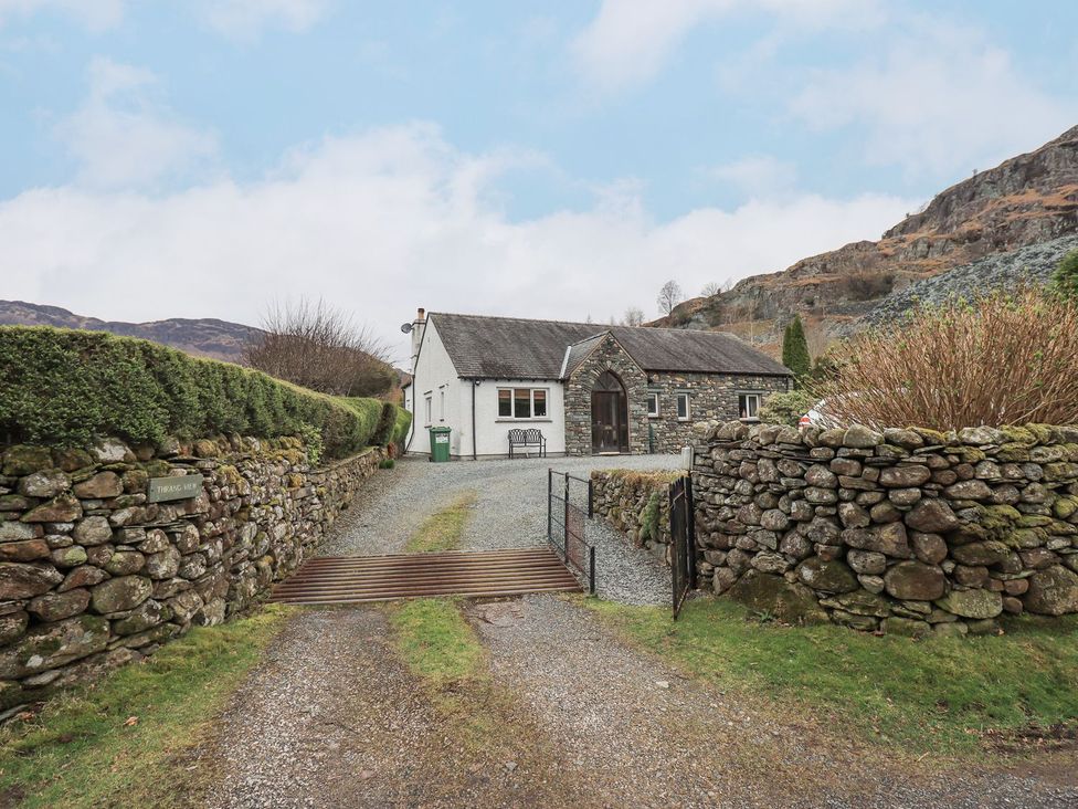 A house with a stone wall and pathway at Thrang View in Chapel Stile