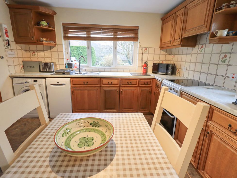A kitchen with a table and bowl located at Thrang View Chapel Stile