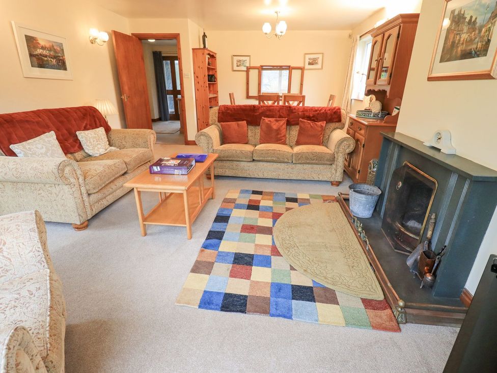 A living room with couch and coffee table at Thrang View in Chapel Stile