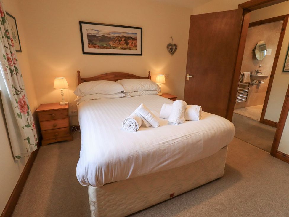 A bedroom with a bed and nightstand at Thrang View in Chapel Stile