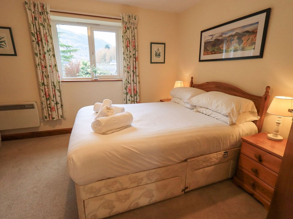 A bedroom with a bed and window at Thrang View in Chapel Stile