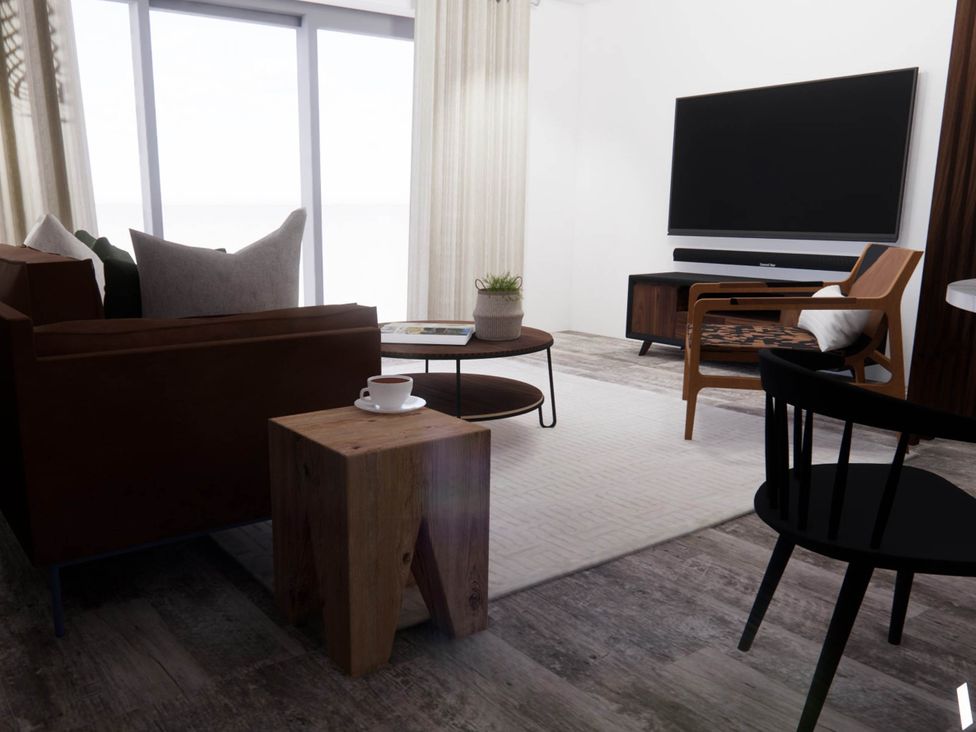 A living room with a sofa and coffee table at Arvo Suite 1.0 in Marhamchurch