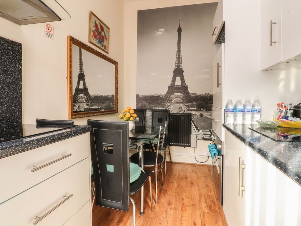 A kitchen with a table and chairs at Number 6 Blackpool