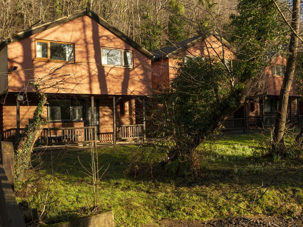 Two houses with balconies and windows set in a natural environment at 2 Bedroom Chalet No.2 Port Talbot