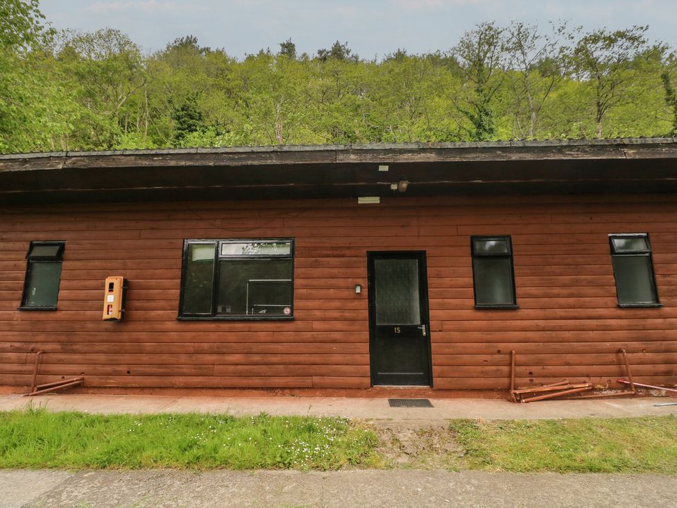 A cabin exterior with door and windows at Cabin No. 15 - Salt and Fern Cabins near Goytre near Port Talbot
