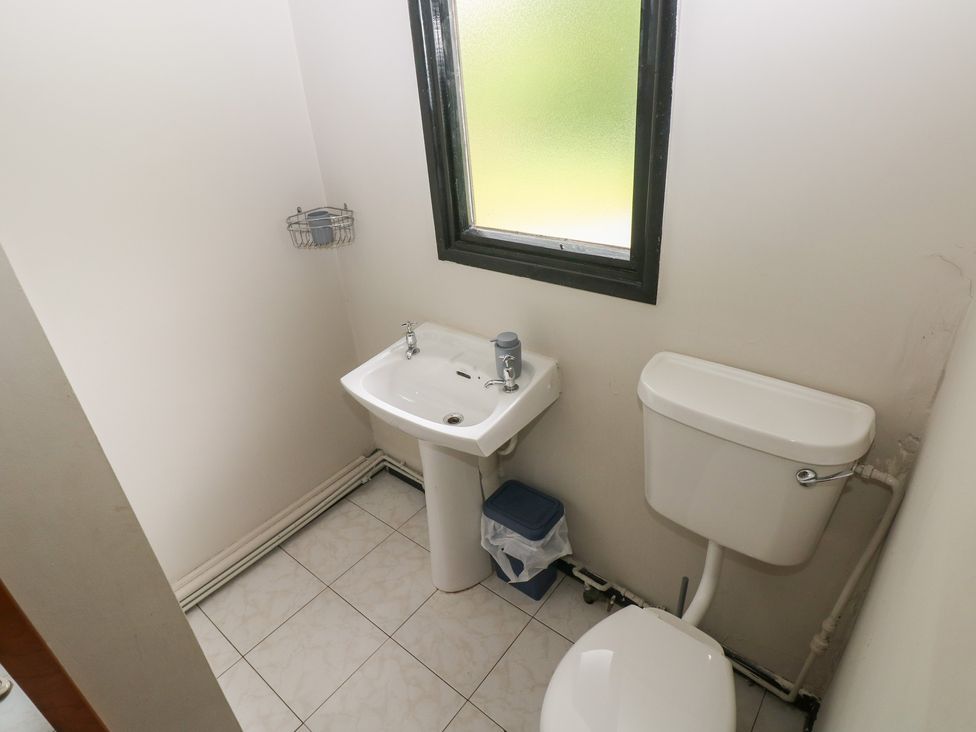 A bathroom with a sink and toilet at Cabin No. 15 - Salt and Fern Cabins in Goytre near Port Talbot