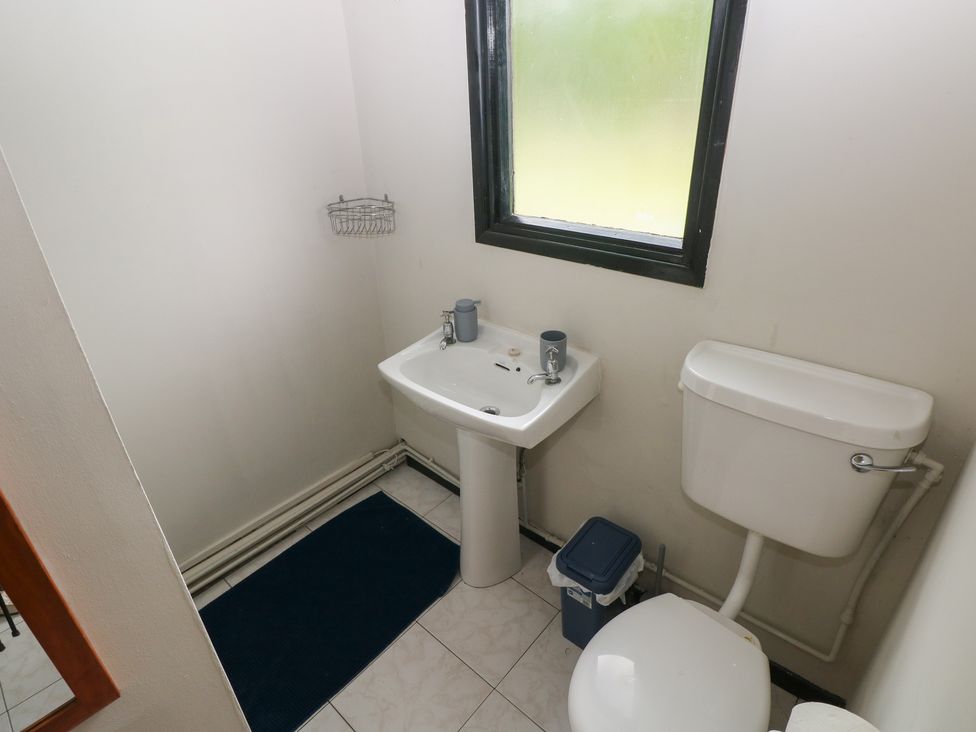 A bathroom with a sink and toilet at Cabin No. 16 - Salt and Fern Cabins Goytre near Port Talbot
