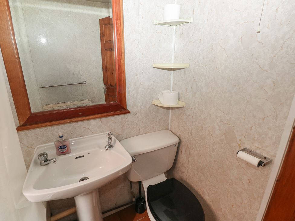 A bathroom with a toilet and wash basin at Cabin No. 4 - Salt and Fern Cabins, Goytre near Port Talbot