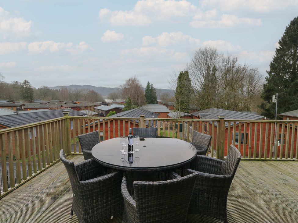 An outdoor area with a circular table and chairs at High Lake View Lodge near White Cross Bay