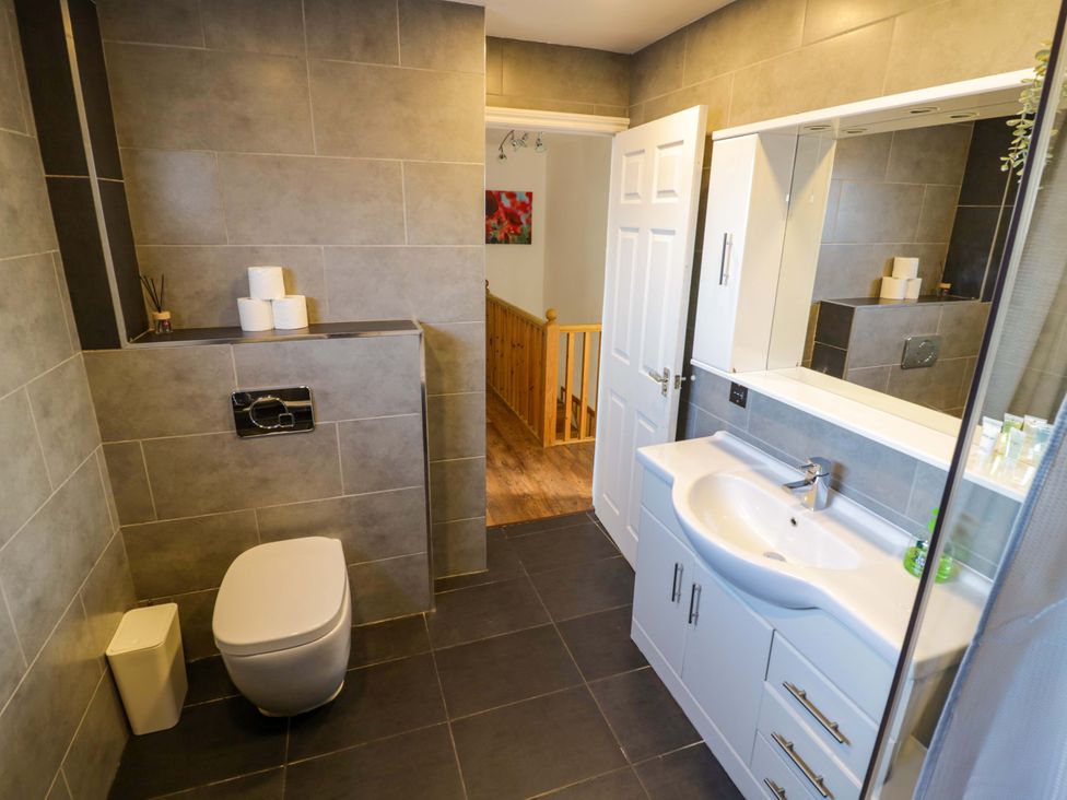 A bathroom with a sink and toilet at 7 Waverton Mews in Royal Leamington Spa