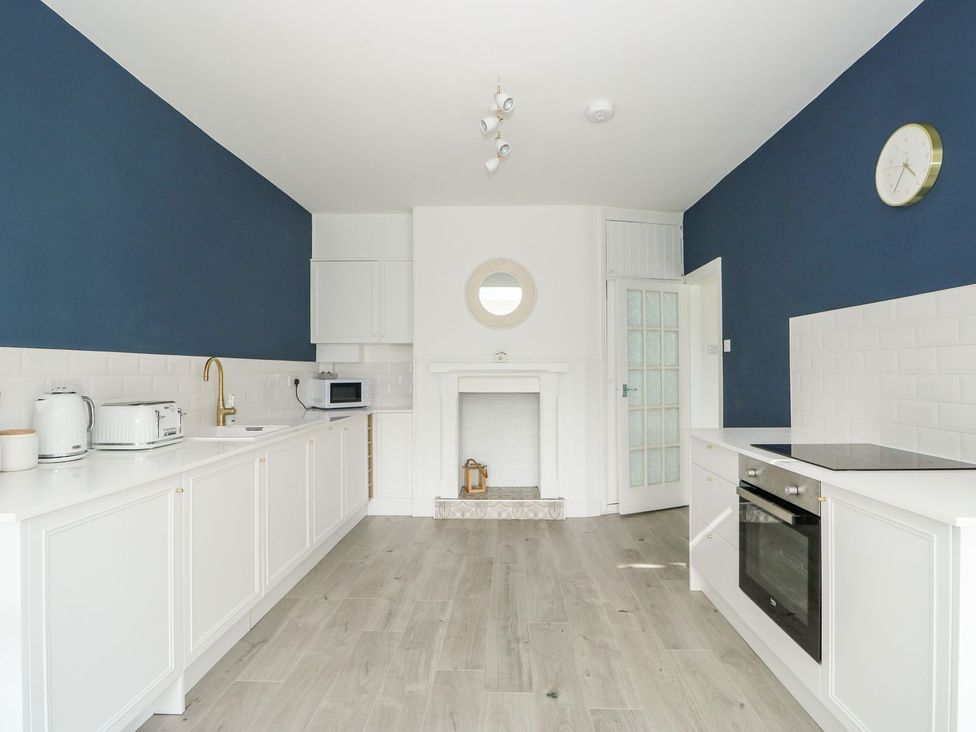 A kitchen with appliances including a kettle and microwave at The Seaside Retreat in Mablethorpe