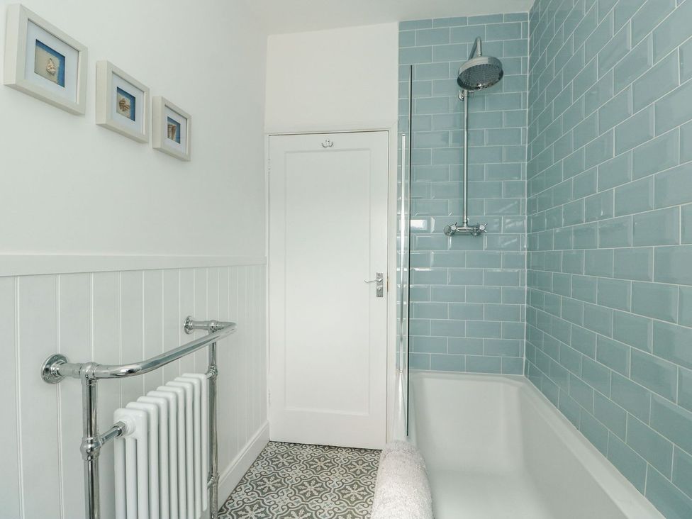 A bathroom with a shower and bathtub at The Seaside Retreat in Mablethorpe