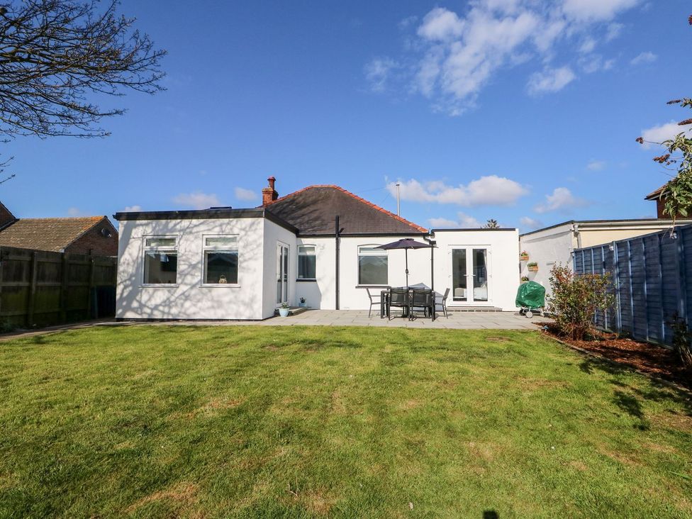 A house with windows and patio furniture at The Seaside Retreat in Mablethorpe