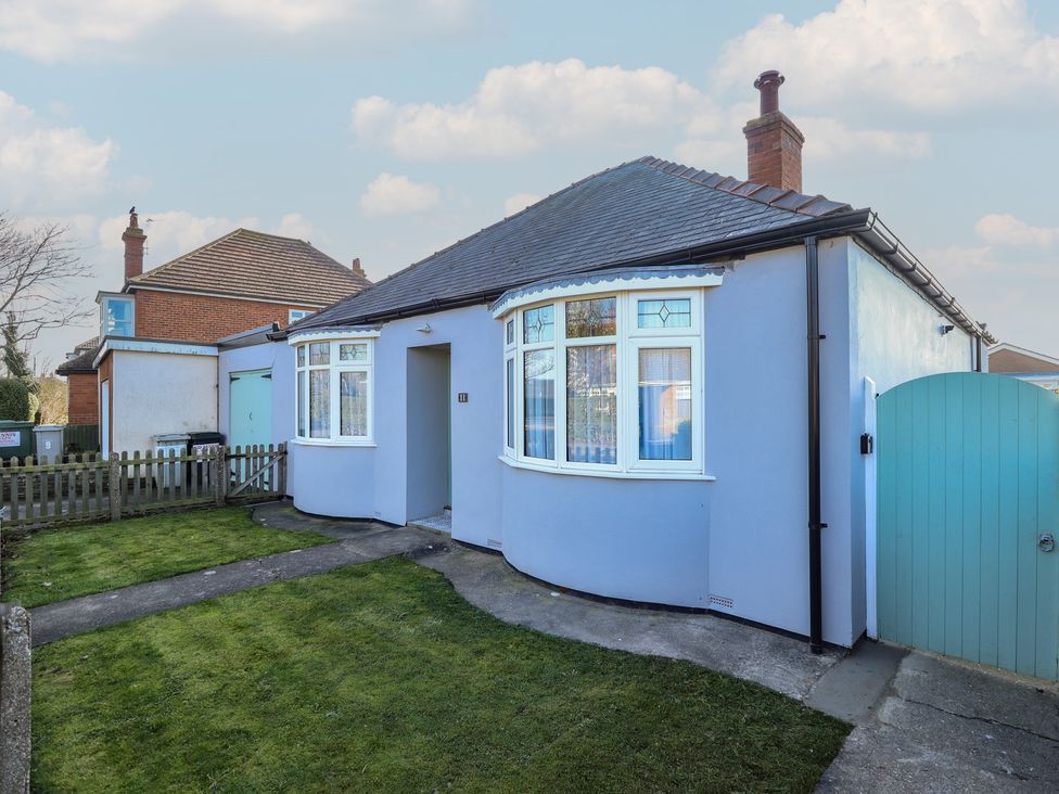 A bungalow with a garden and pathway at The Seaside Retreat Sutton-On-Sea