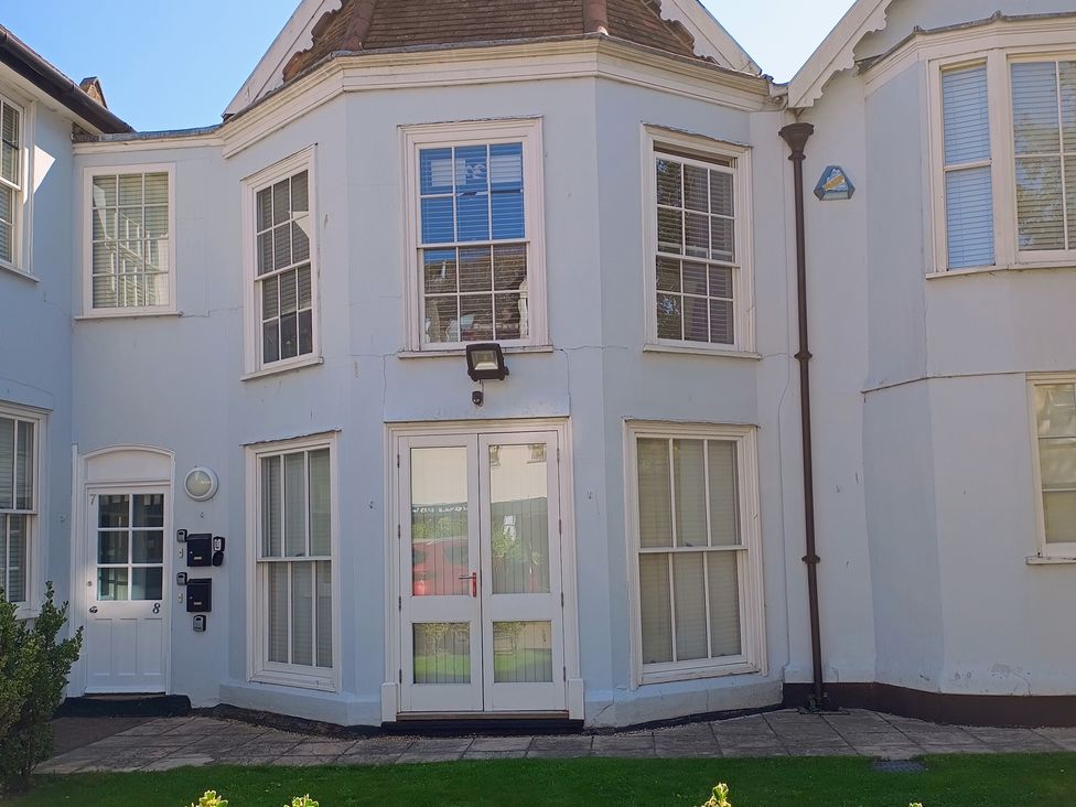 An exterior view of a property showing windows and a door at Flat 2 Ipswich