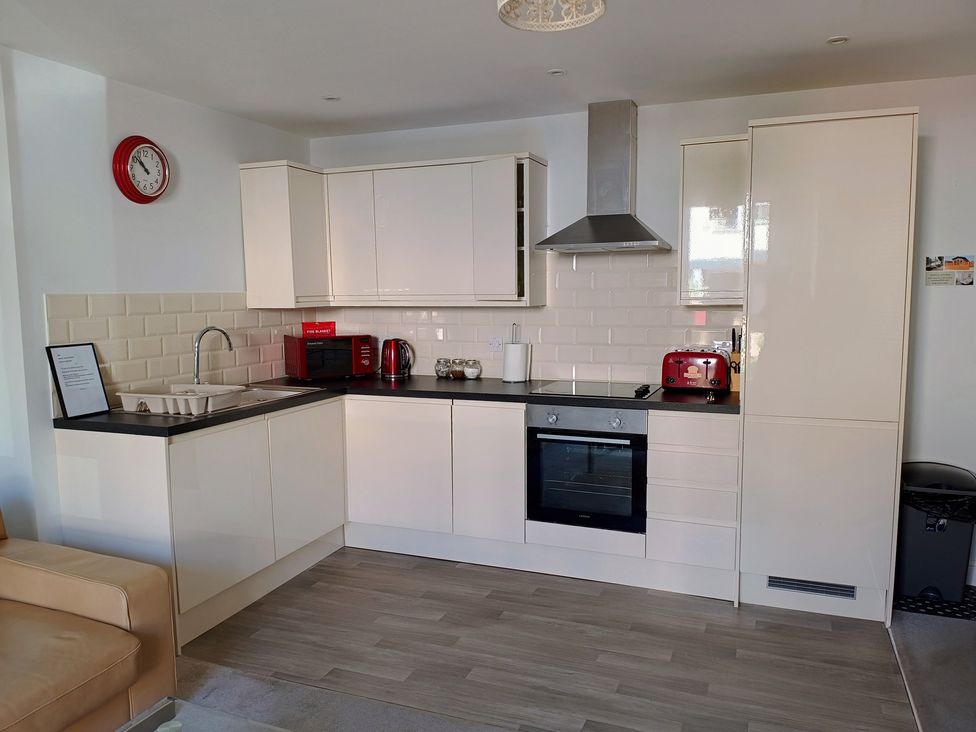 A kitchen with a sink and appliances at Flat 2 in Ipswich