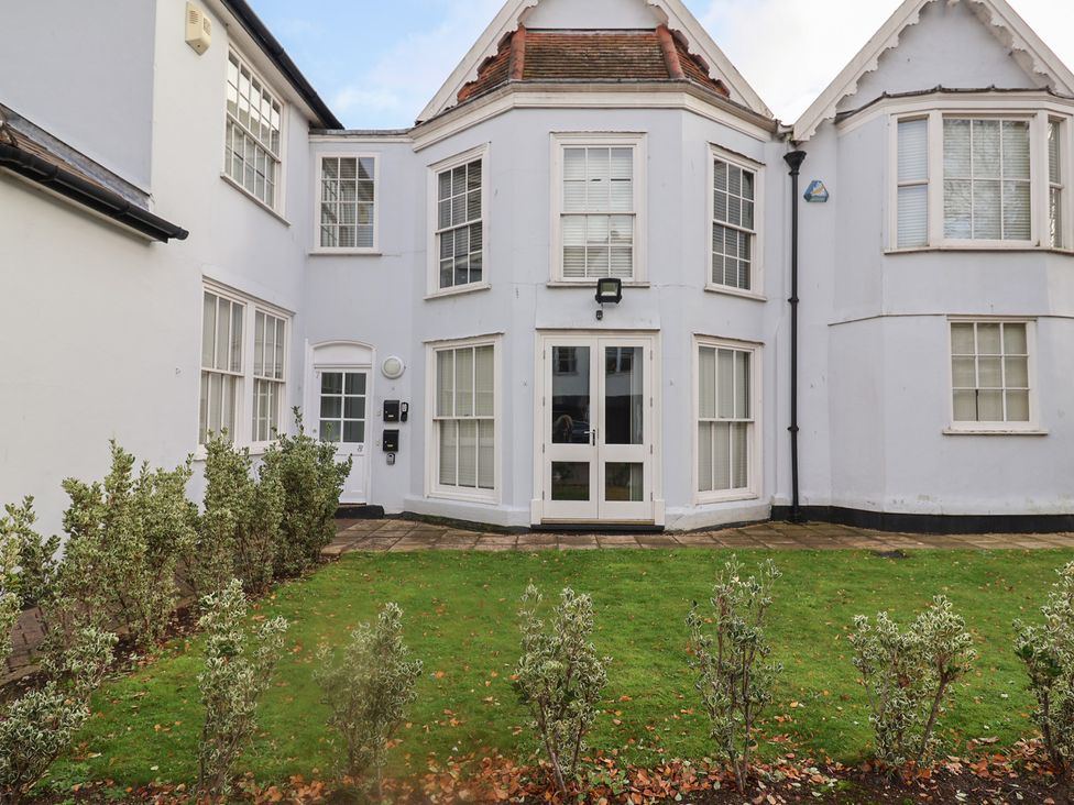 An outdoor view of a building with garden space at Stylish Central Ipswich Apartment Near the Waterfront with Parking Ipswich