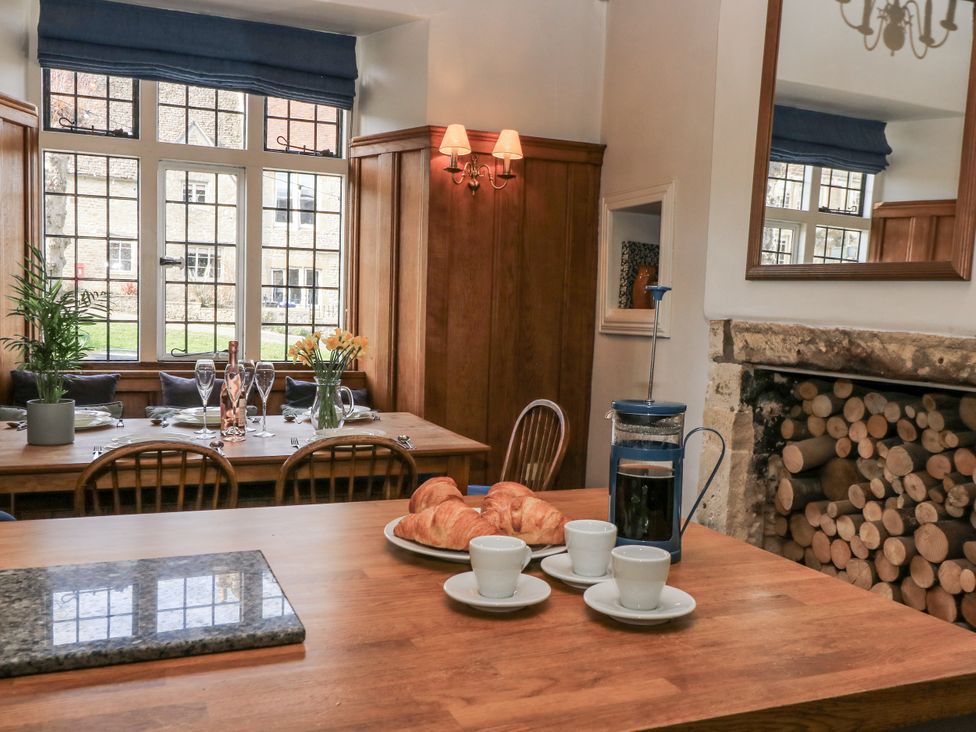 A dining room with a table and coffee set at Ostlers Burford