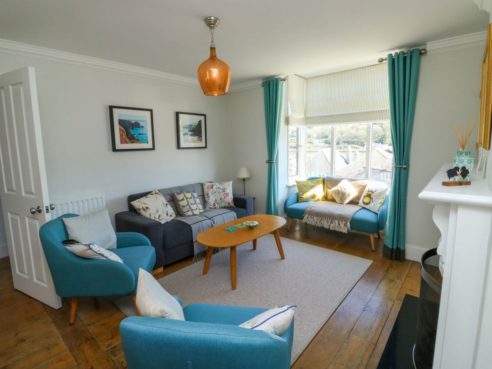 A living room with two armchairs and a coffee table at 43 Sandquay Road in Dartmouth