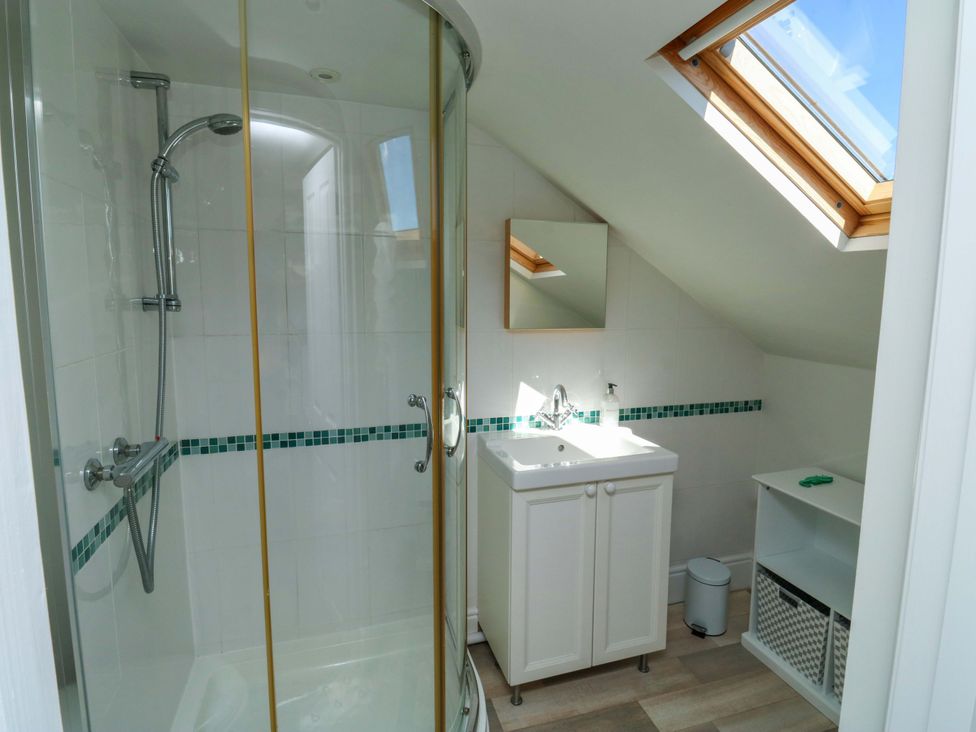 A bathroom with a shower and sink at 43 Sandquay Road, Dartmouth
