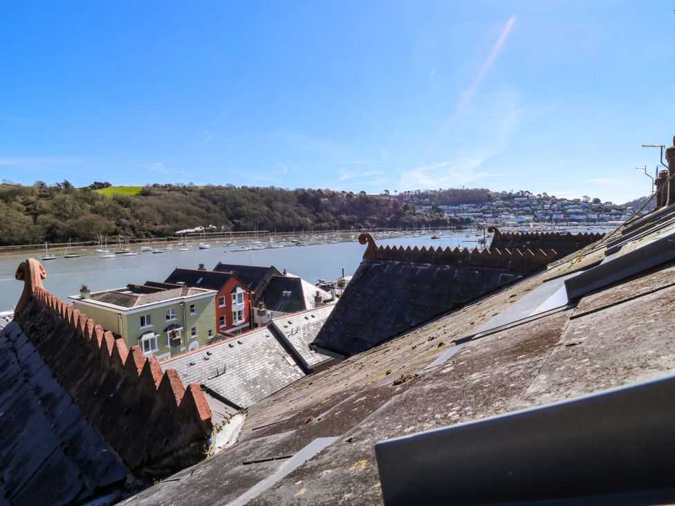 A view of rooftops and a river with boats at 43 Sandquay Road Dartmouth