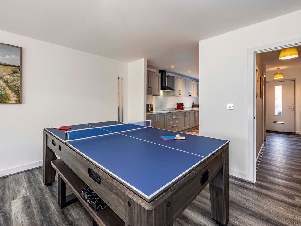 A game room with a ping pong table at 3 Riverside Mews in Derby