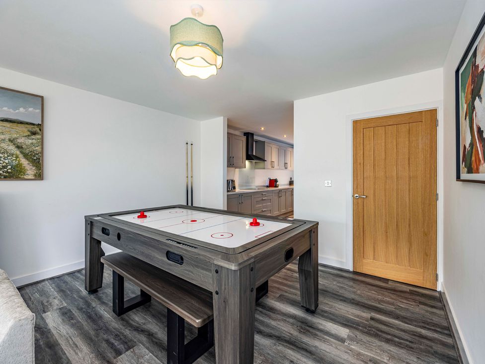 A game room with an air hockey table at 4 Riverside Mews in Derby