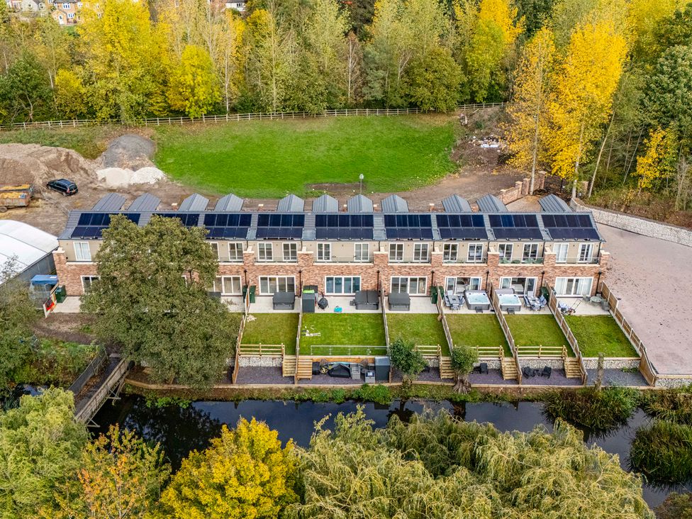 An outdoor area with townhouses featuring solar panels at 6 Riverside Mews in Derby